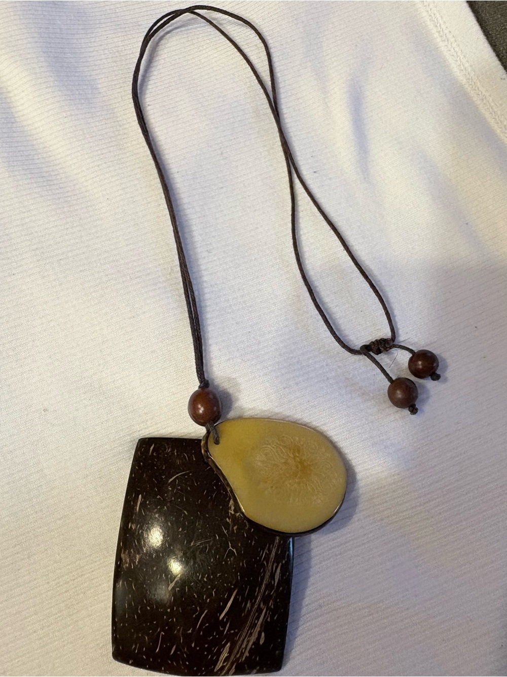 Handcrafted Brown and Tan Coconut Pendant Necklace.